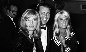 Dirk Bogarde arriving with British actress Julie Christie (l