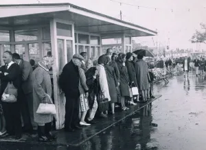 Disappointed holidaymakers shelter from the rain at Southend during the August Bank