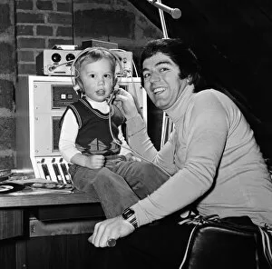 01195 Collection: Disc Jockey Tony Blackburn and his son Simon, 3, in their private recording studio in