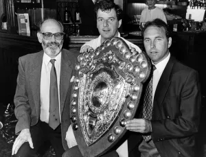 Displaying the Federated Homes League Premier Division Trophy at the Cross Hands