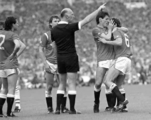 Images Dated 18th May 1985: Distraught Manchester United footballer Kevin Moran is consoled by teammate Frank