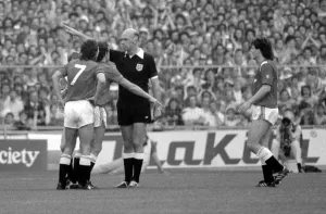 Distraught Manchester United footballer Kevin Moran becomes the first player ever to be