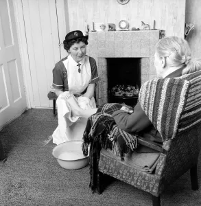The District Nurse: General scenes of District Nurse Muggeride out on her rounds visit