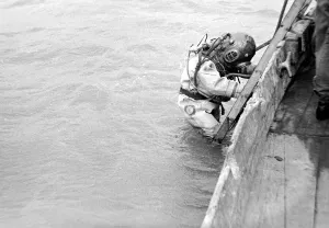 Core46 Prints: A diver wearing protective equipment goes down into the water at a Naval diving school in