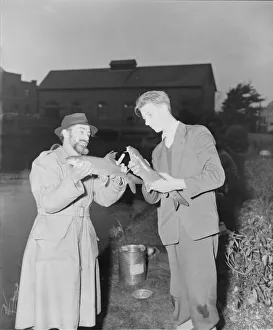DM Anglers R Lalley B Venables Men holding and comparing fish