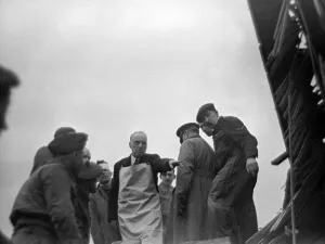 00168 Prints: A doctor directs rescue workers following overnight air raids on London February