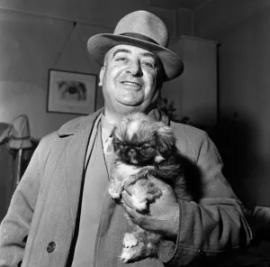 How much is that dog in the window'. A man holding a dog inside Alderbournes