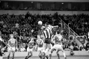 Don Goodman of West Bromwich Albion rises above everyone to flick on a header during