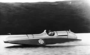 Donald Campbell at the wheel of Bluebird at a speed of 90mph on enestan water