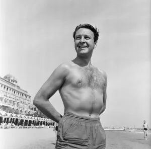 00681 Prints: Donald Sinden seen here on the beach during the Venice Film Festival. 8th September 1955