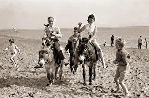 Donkey rides on Exmouth Beach Children childhood Holidaymakers