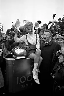 Record Prints: Donna Douglas (black coat) who is appearing in Cinderella