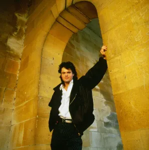Donny Osmond singer The Osmonds pop group July 1987 standing under an arch