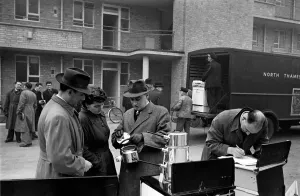 Door to Door Salesmen selling domestic appliances to residents on a housing estate