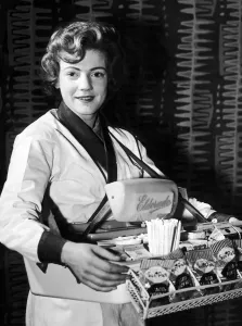 Cinemas Prints: Dorothy Smith, Usher selling ice cream and cigarettes at local cinema, Glasgow, Scotland
