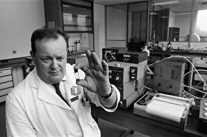 Dr. Frank Skuse studies a blood sample for alcoholic content at the North West Forensic