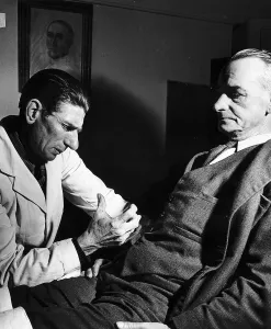 Weird Prints: Dr Robert injects a hypodermic into his patient suffering from a gastric ulcer