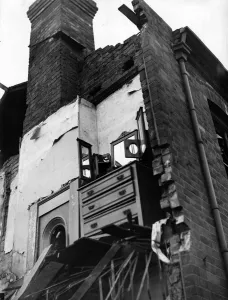 A dressing table is all that remains standing in a bombed house in Birmingham