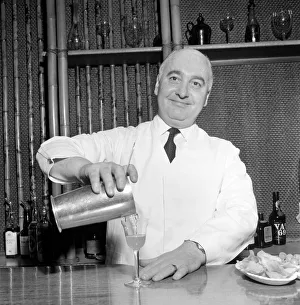 Cocktail Prints: Drinks: Cocktails Joe Gilmore top barman at the Savoy hotel in London seen here preparing