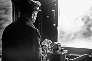 Driver of a Southern Railways Electric Multiple Unit train approaching Rayners Park