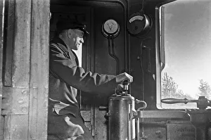 01259 Prints: Driver of a Southern Railways Electric Multiple Unit train at Rayners Park Station