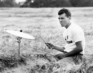 Crops Prints: Drummer Dave Hemingway during filming of a Housemartins video at Park Farm, Walkington
