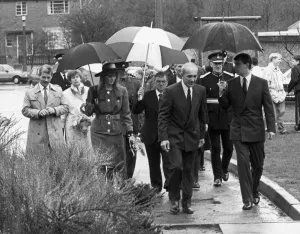 Umbrellas Prints: The Duke and Duchess of York seen here during a rain soaked visit to the Aycliffe Centre