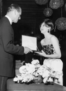 01440 Prints: Duke Of Edinburgh. Leslie Caron receiving a Variety Club award from Prince Philip - May