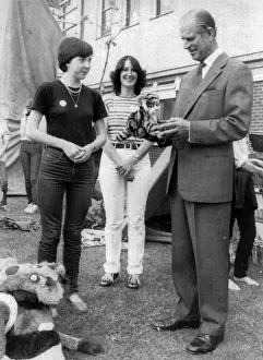 The Duke of Edinburgh. Patricia Woods is gives a toy Tiger Prince Philip