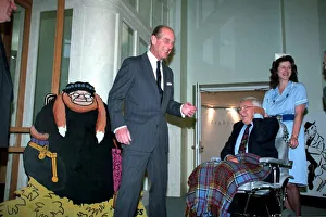 The Duke of Edinburgh, Prince Philip with Cartoonist Carl Giles at exhibition of