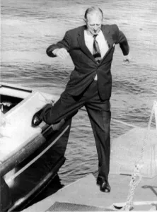 01440 Prints: The Duke of Edinburgh. Prince Philip leaps from a boat onto the quay during a visit to