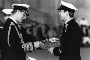 The Duke of Edinburgh. Prince Philip presents the Louis Newmark trophy to his son