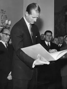 01440 Prints: The Duke of Edinburgh. Prince Phillip receives a cookbook from the Variety club