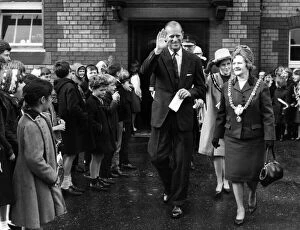 01035 Collection: The Duke of Edinburgh walks through the lines of flag waving pupils at Kitchener Road