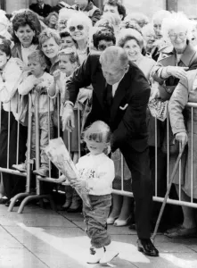 01430 Prints: The Duke picks Pauline Smith from the crowd & points her in the direction of the Queen