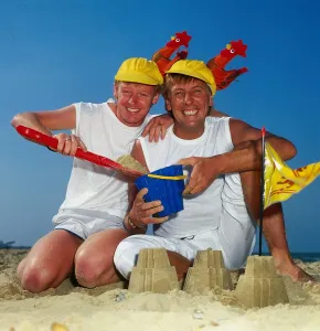 Spade Prints: Dustin Gee on the beach with fellow comediy partner Les Dennis, 1985