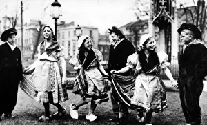 01004 Prints: Dutch children dancing on College Green in traditional dress in the mid 1940