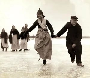 Dutch children skating on the frozen inland sea near their home of Volendam, Holland