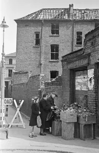 Vegetables Prints: East End greengrocer doing his best to remain open for his customers despite