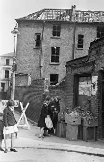 01491 Prints: East End greengrocer doing his best to remain open for his customers despite