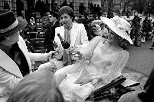 Images Dated 30th March 1975: The Easter parade, Battersea Park. Film star Carol Baker gets a drink of champagne before