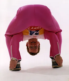 Eagle Prints: Eddie Edwards in pink ski clothing bending down and touching his heels
