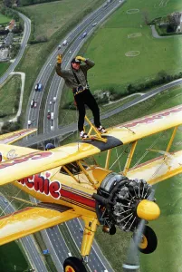 Eddie Kidd flying above M25 to publisize the Skip Lunch appeal Dbase MSI Glossary