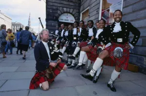 Edinburgh Festival August 1989 Black Theatre Company with piper Sandy Davidson