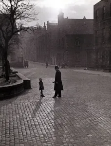 00001 Prints: Edinburgh street scenes Policeman talking to lost child on a cobbled street in