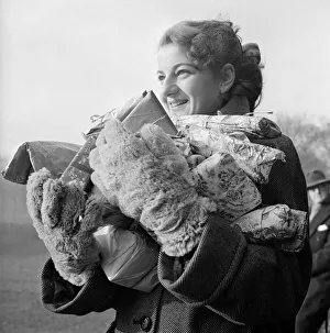 Gloves Prints: Edna Colyer ready too hand out Christmas Presents to the Hearne Hill Harriers after a