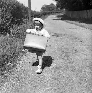 00077 Prints: Education: Boarding School: Jane Wicken seen here returning to Ledsham Court School after