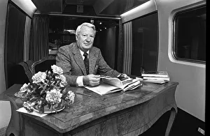 Edward Heath onboard a train at Moor Street Station signing copies of his latest books