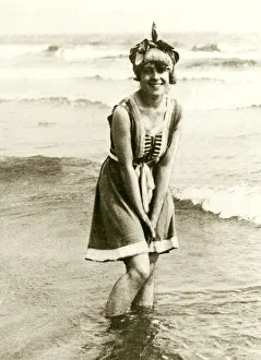 Edwardian Fashions 1910s Bathers playing in the sea wearing a swimming costume one