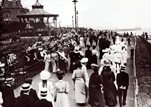 Men And Women Prints: Edwardian Ladies and Gentleman walk up and down the promenade of an unnamed English South
